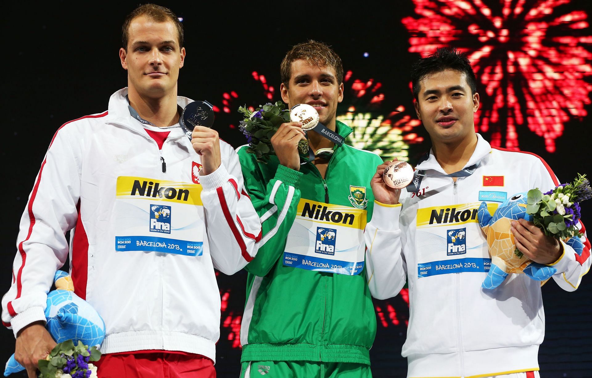 Pawel Korzeniowski (Silver medalist), Chad Le Clos (Gold medalist) Wu Peng (Bronze medalist) after Men's 200m Butterfly Final at the 15th FINA World Championships at Palau Sant Jordi.